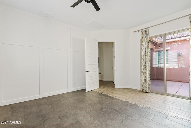 empty room with hardwood / wood-style flooring and ceiling fan