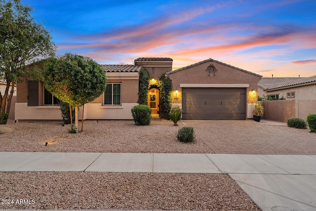 view of front of property with a garage