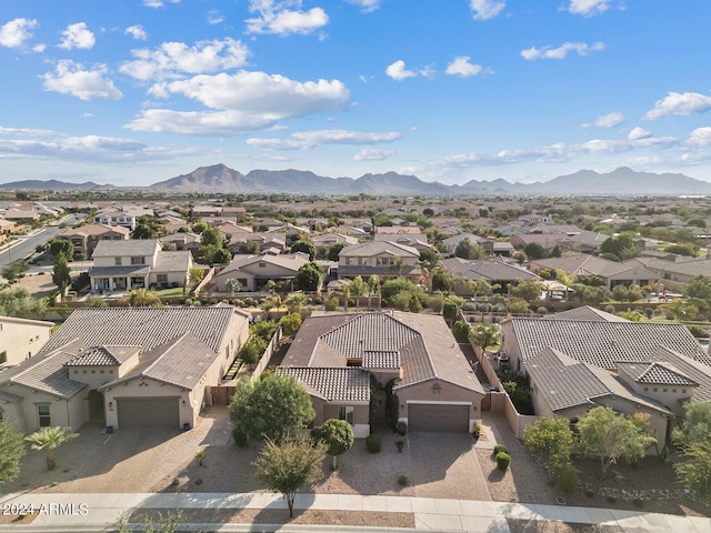 birds eye view of property with a mountain view