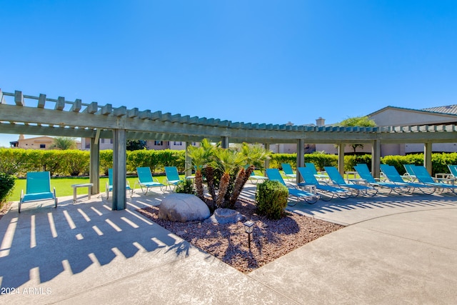 view of swimming pool featuring a patio and a pergola