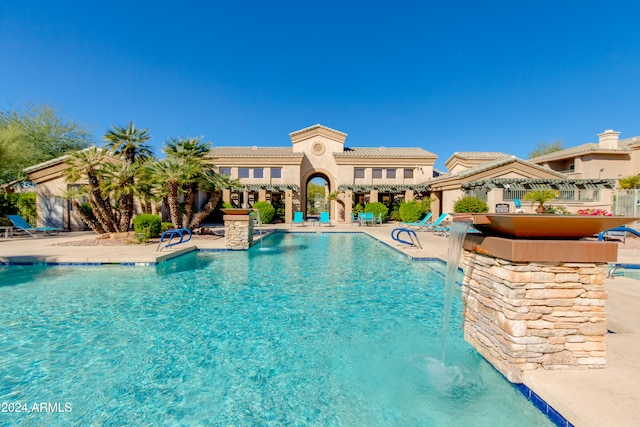 view of pool featuring a patio area and pool water feature