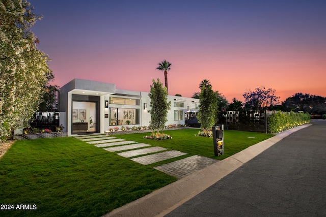 contemporary house featuring a lawn