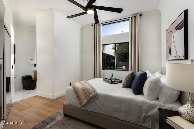 bedroom with ceiling fan, light hardwood / wood-style floors, and ornamental molding