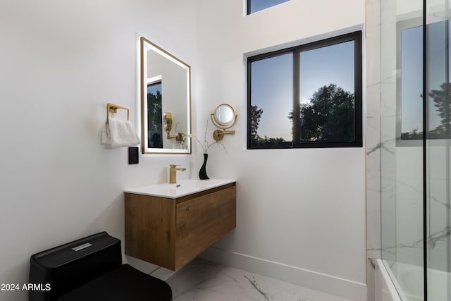 bathroom featuring tile flooring, vanity, and tiled shower / bath