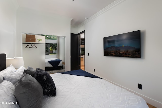 bedroom featuring crown molding