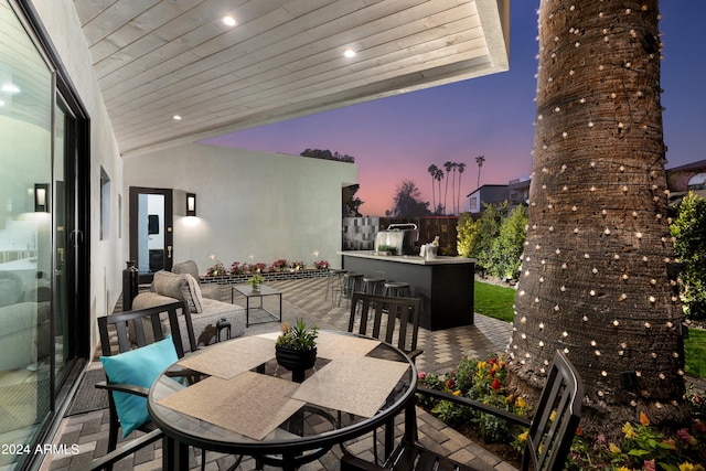 patio terrace at dusk with exterior bar