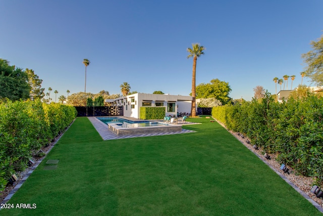 view of yard with a patio area and a fenced in pool