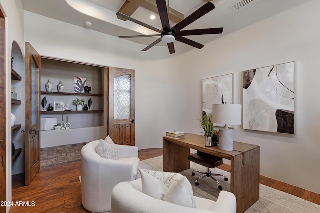 home office with dark hardwood / wood-style floors and ceiling fan