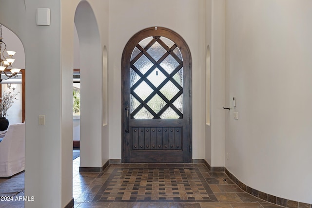 foyer with a chandelier