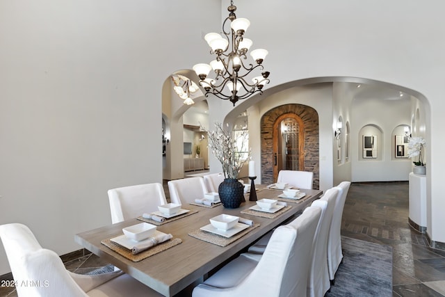 dining space with a chandelier