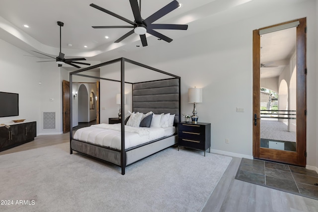 bedroom featuring hardwood / wood-style flooring and ceiling fan