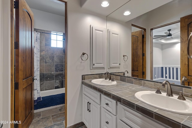 bathroom with ceiling fan and vanity