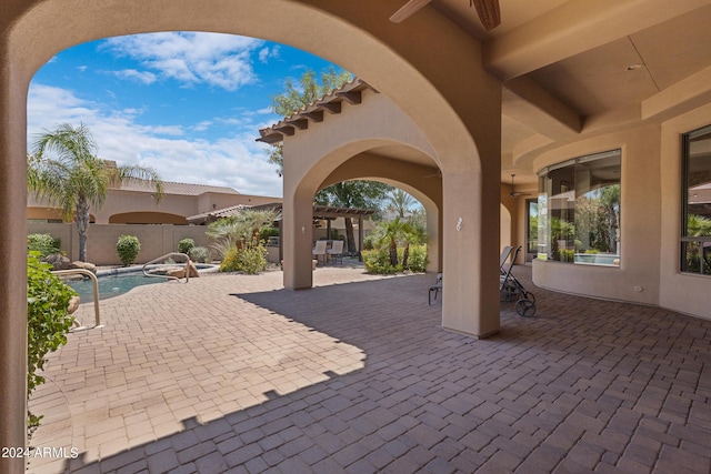 view of patio / terrace featuring a fenced in pool and a pergola