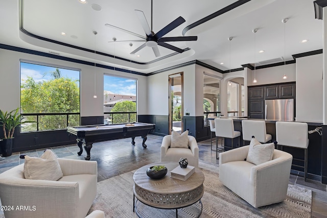 playroom with ceiling fan, crown molding, pool table, and a tray ceiling