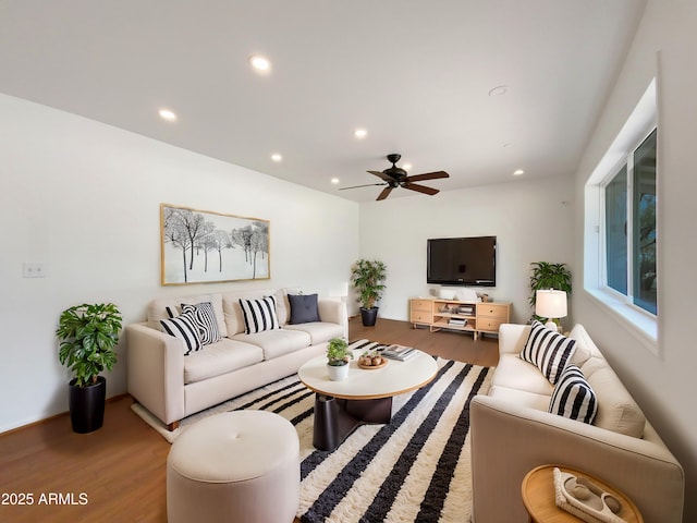 living area with recessed lighting, ceiling fan, and wood finished floors