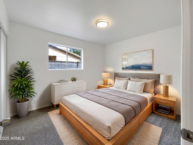 bedroom featuring baseboards and carpet floors