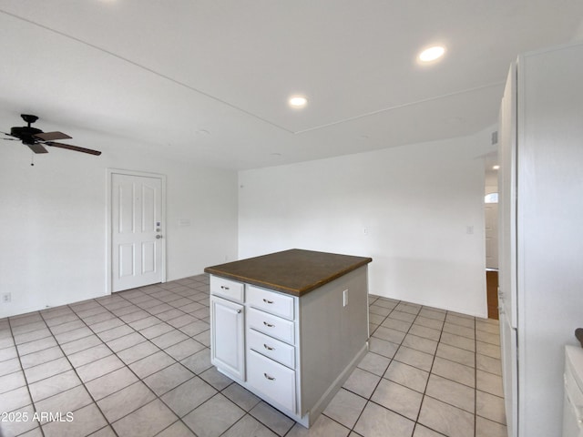 kitchen with light tile patterned flooring, recessed lighting, white cabinetry, and a ceiling fan