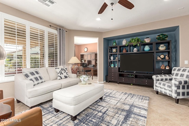 tiled living area with visible vents, recessed lighting, and a ceiling fan