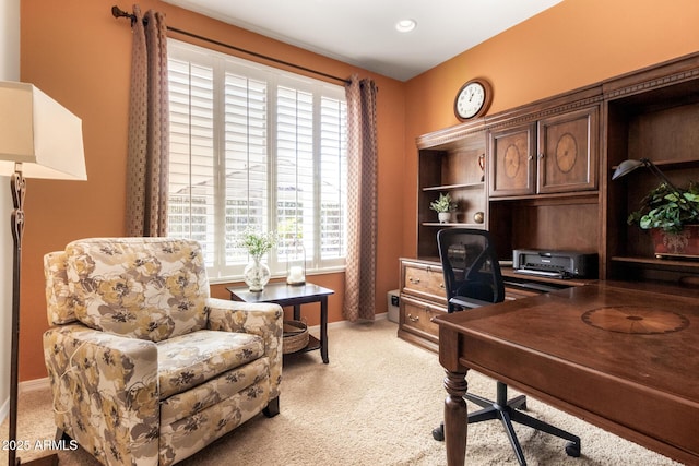 home office with light colored carpet and baseboards