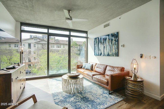 sunroom / solarium featuring visible vents and a ceiling fan