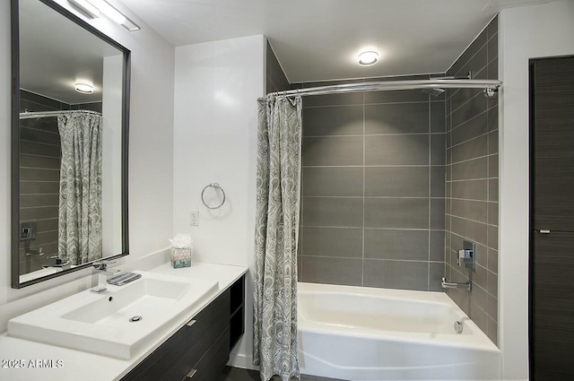 bathroom with shower / tub combo and vanity