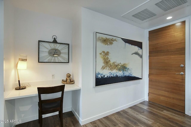 corridor with visible vents, baseboards, and dark wood-type flooring