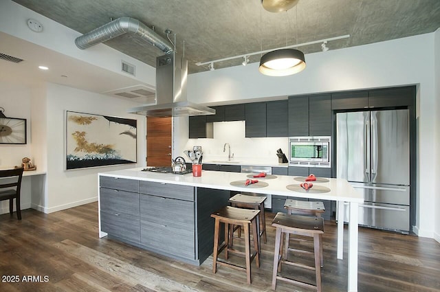 kitchen with light countertops, appliances with stainless steel finishes, modern cabinets, and visible vents