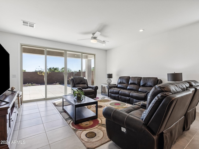 tiled living room with ceiling fan