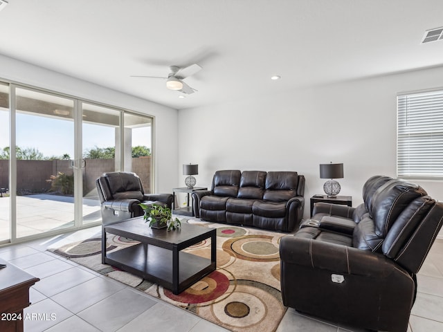 living room with light tile patterned flooring and ceiling fan