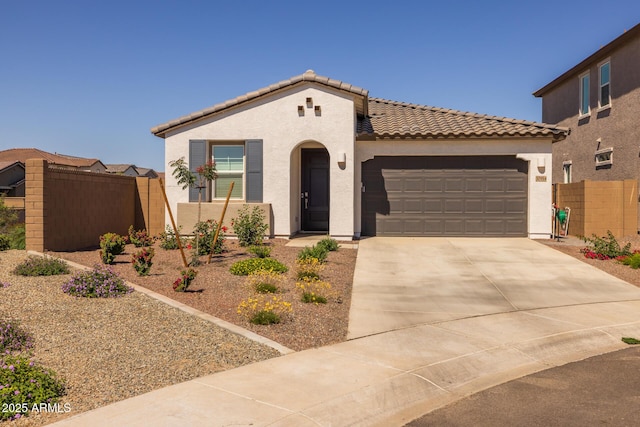 37954 N Greasewood Way, San Tan Valley, AZ 85140 - mediterranean / spanish house featuring a tile roof, stucco siding, a garage, and fence