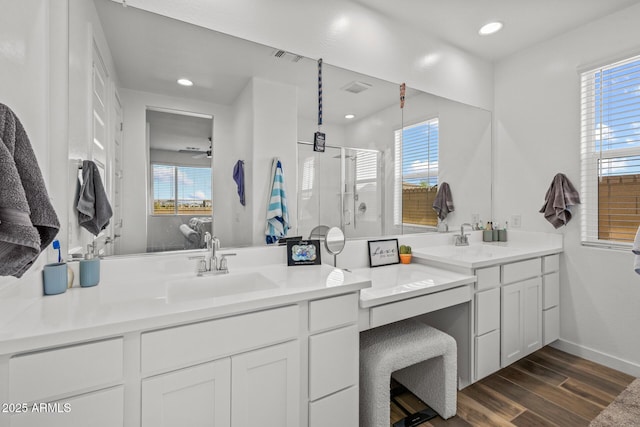 37954 N Greasewood Way, San Tan Valley, AZ 85140 - bathroom with a shower stall, healthy amount of natural light, wood finished floors, vanity, and recessed lighting