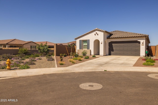 37954 N Greasewood Way, San Tan Valley, AZ 85140 - mediterranean / spanish house with stucco siding, fence, a garage, concrete driveway, and a tiled roof