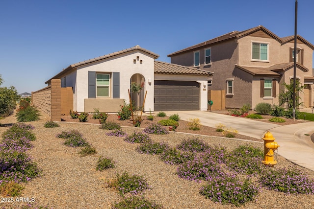 37954 N Greasewood Way, San Tan Valley, AZ 85140 - view of front of house with a tiled roof, an attached garage, stucco siding, and driveway
