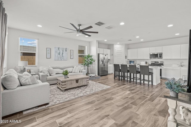 37954 N Greasewood Way, San Tan Valley, AZ 85140 - living room featuring ceiling fan, light wood-style flooring, and recessed lighting