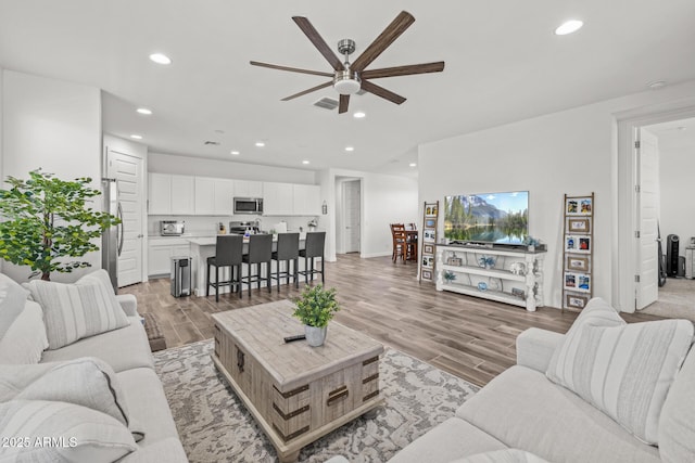 37954 N Greasewood Way, San Tan Valley, AZ 85140 - living area with a ceiling fan, light wood-type flooring, recessed lighting, and baseboards