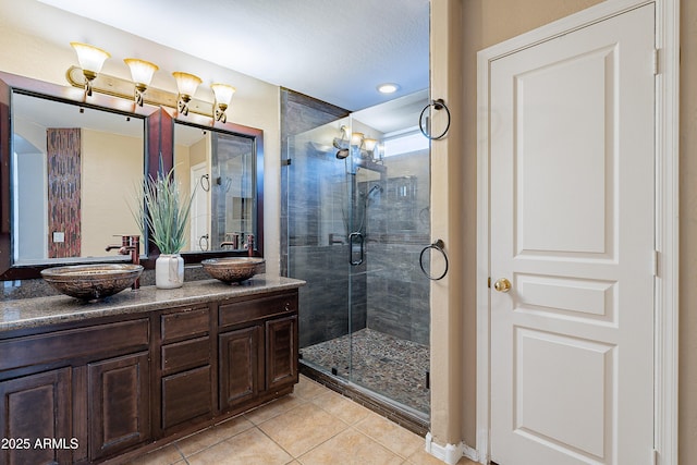 bathroom with vanity, tile patterned floors, and walk in shower