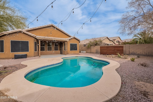 view of swimming pool with a patio area