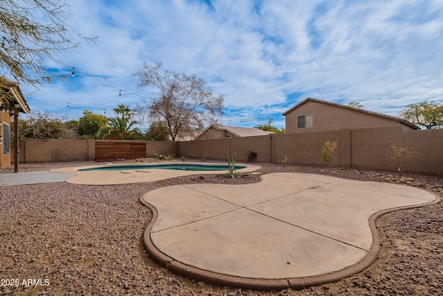 exterior space featuring a fenced in pool