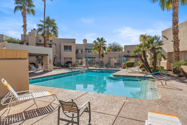 view of swimming pool featuring a patio area