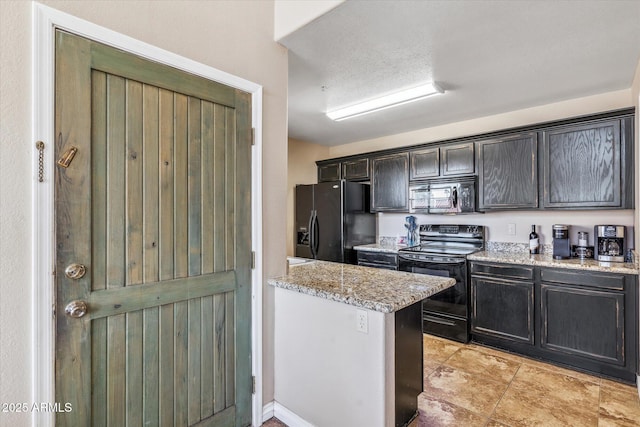 kitchen featuring light stone countertops and black appliances