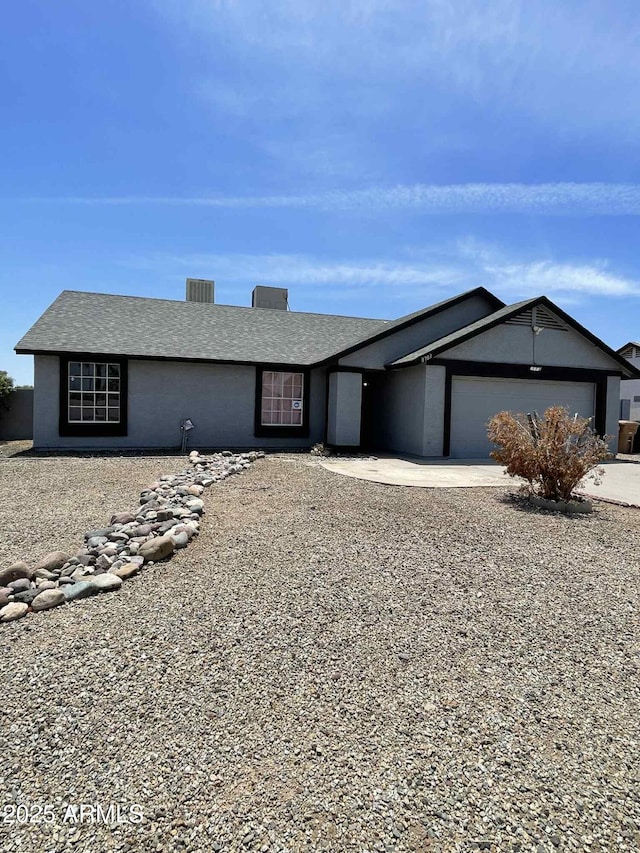 8703 W Golden Ln, Peoria, AZ 85345 - single story home with concrete driveway and a garage