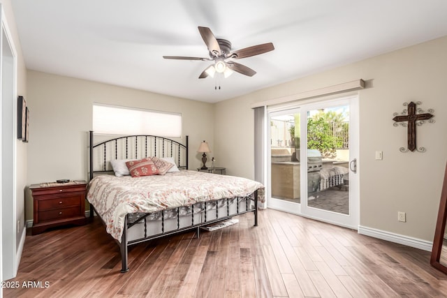 bedroom featuring access to outside, ceiling fan, baseboards, and wood finished floors