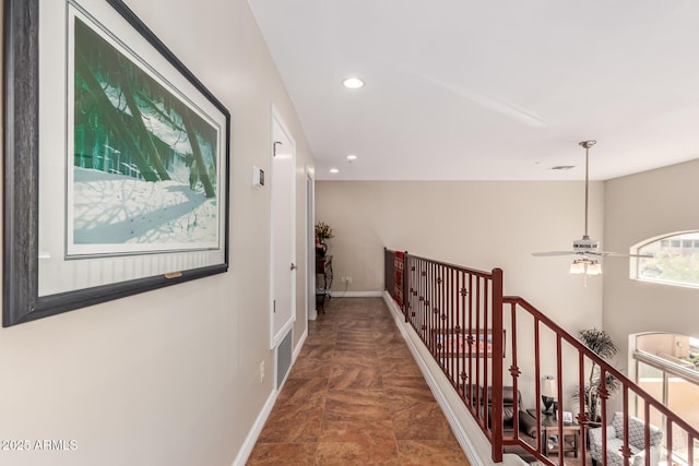 corridor featuring visible vents, recessed lighting, an upstairs landing, and baseboards