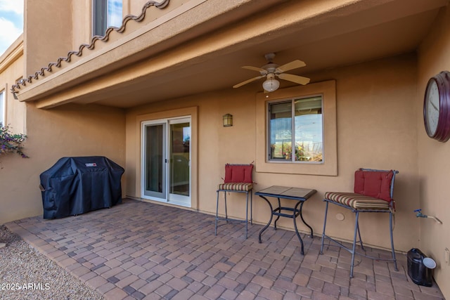 view of patio / terrace with ceiling fan and area for grilling