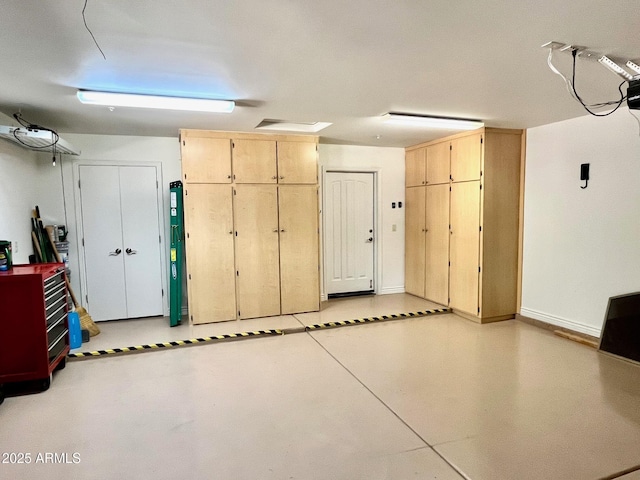 garage featuring baseboards