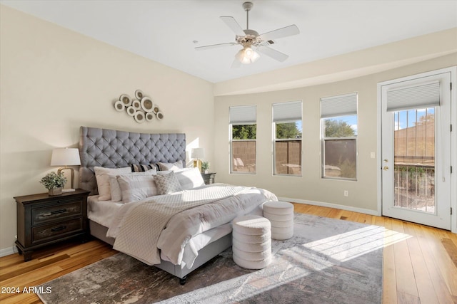 bedroom featuring access to outside, ceiling fan, and light wood-type flooring