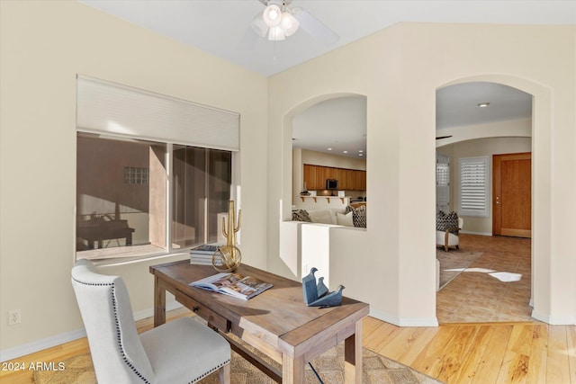 office space with ceiling fan and light wood-type flooring