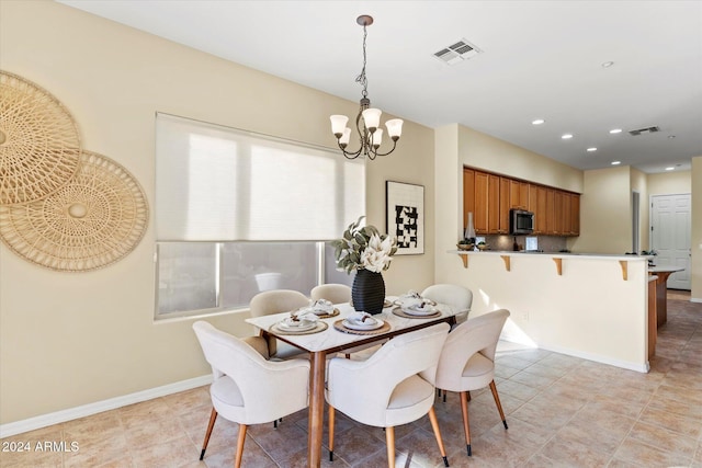 dining room with a notable chandelier