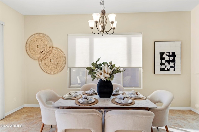 dining room with a wealth of natural light and an inviting chandelier