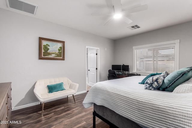 bedroom featuring dark wood-style flooring, visible vents, and baseboards